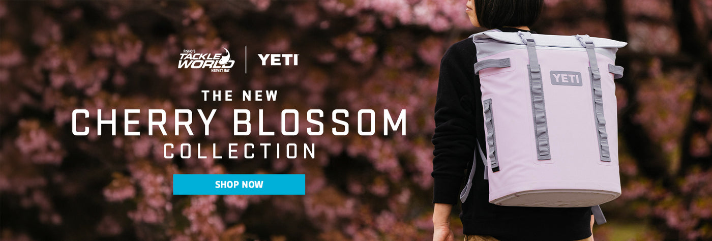 Person carrying a Yeti cooler with cherry blossom background and promotional text.